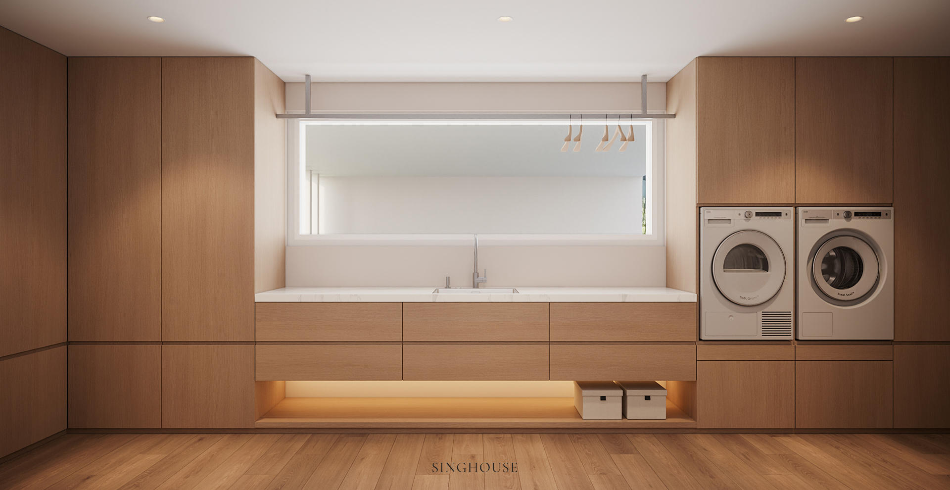 Thiết kế căn hộ Scandinavian ở Đà Nẵng tích hợp máy giặt, máy sấy và khu vực giặt vào hệ tủ gỗ cánh phẳng, giữ các thiết bị kết nối trong một bố cục gọn gàng.